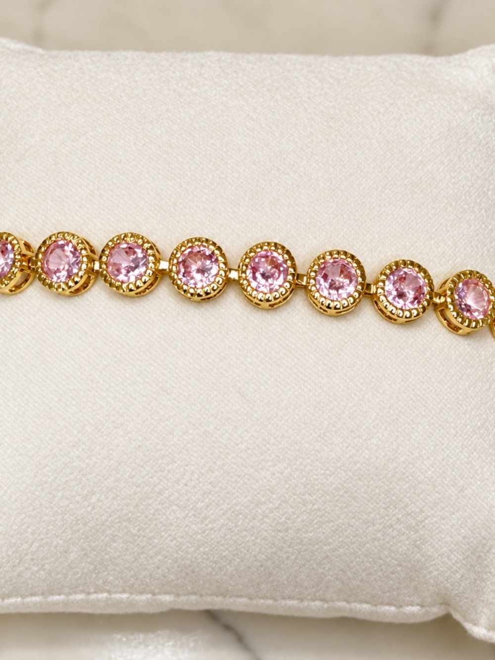 Pink tennis bracelet with round cz stones 14k gold plated, 7 inches